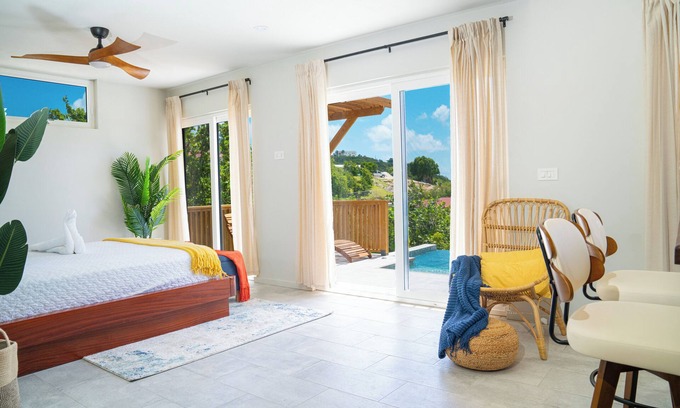 Saint George Parish Cottage | Affordable luxury, with runway views and tropical breeze.