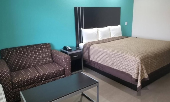Bay City Hotel | Affordable Room w/Complimentary Breakfast, Microwave, and Full-Size Fridge