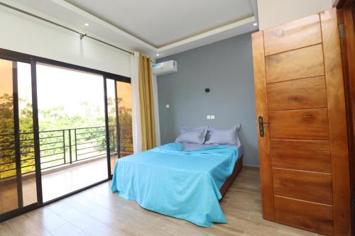Kribi Apartment | AfriqPnB RF2 Chambre Mvog Ekoussou avec Piscine