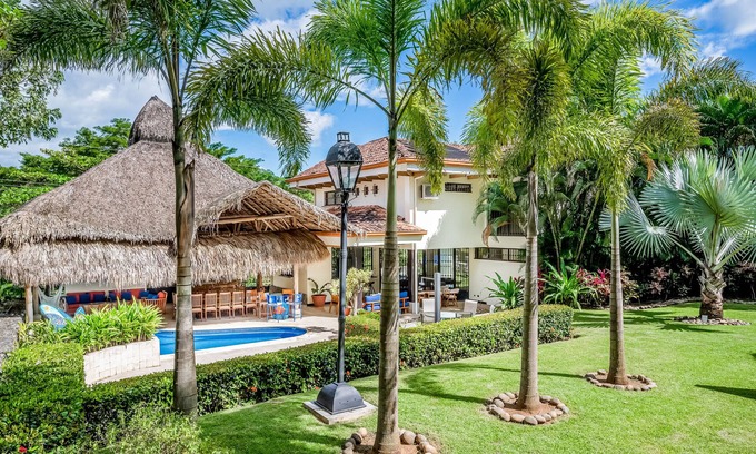 Coco House | Airy oasis with a grand outdoor space, private pool, & shared tennis court