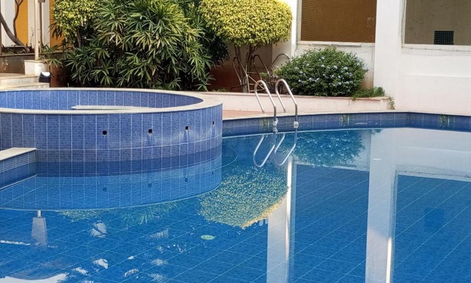 Bengaluru House | Amazistay offers Luxury room with private bathroom, balcony & 55 inch TV & shared Jacuzzi paid access, Book Lover, near Ramaiah College Hospital