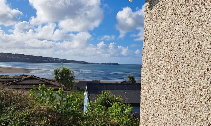 Hayle Cottage | Amulree is a traditional beach chalet which enjoys stunning views of St. Ives bay