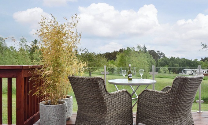 Swarland Cottage | An elegant lodge with lovely raised deck to relax overlooking the golf course.