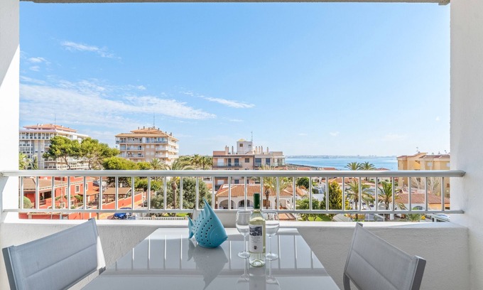 Punta Prima Apartment | Apartment 'Beach Front Sea View Punta Prima' with Sea View, Wi-Fi and Air Conditioning