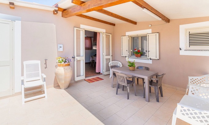 Granelli Apartment | Apartment 'Nonna Rosa' with Private Terrace, Shared Garden and Air Conditioning