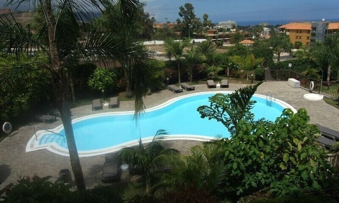 Puerto de la Cruz Apartment | Apartment with great sea and Teide view, with 2 terraces, pool and beautiful gardens