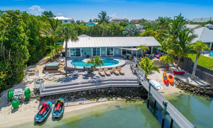 Stuart House | Aquatopia North: Riverfront beach house, w/dock, heated pool + hot tub & more!