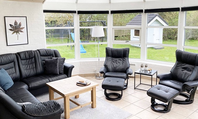 Blavand Strand House | Attractive holiday home on a lawn, with window front including WiFi, annex