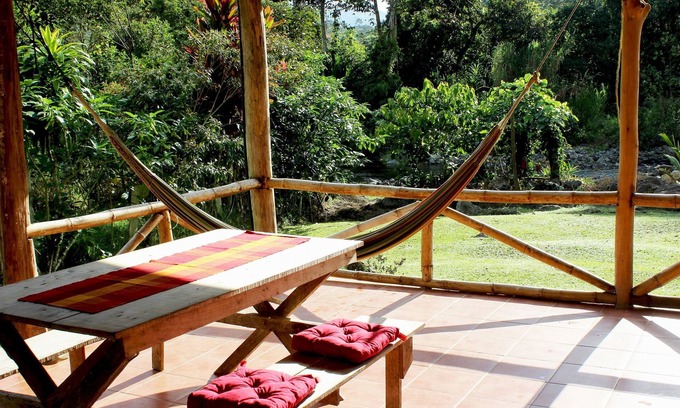 La Suiza Cottage | Authentic Vacation Home in Unique Setting of 25 Acres of Tropial River Landscap
