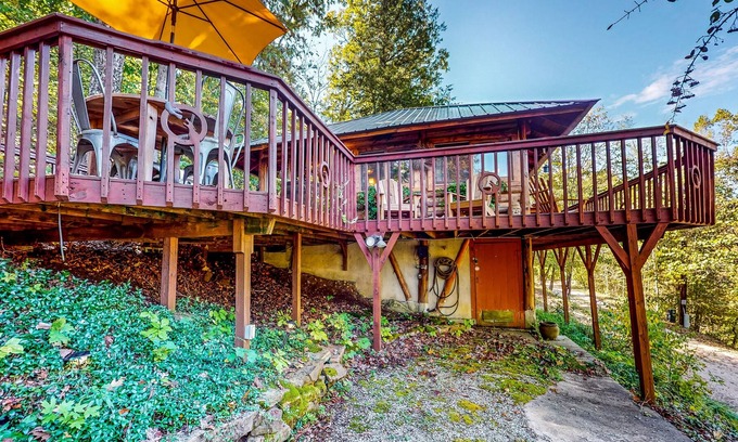 Eureka Springs Cabin | Authentic Lake Lucerne cabin with wrap-around deck, grill, wood stove, views