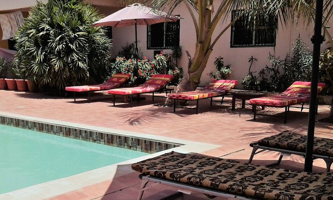 Kerr Serign Bed & Breakfast | B & B Villa Calliandra, large room for max. 5 with pool and tropical garden