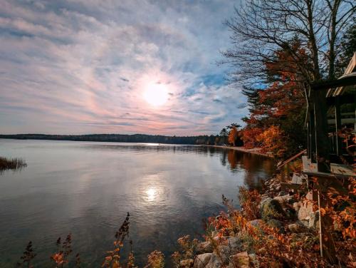 Sullivan House | Back of the Moon Lakefront Camp family watersports fire pit 1 dog beach sleeps 8