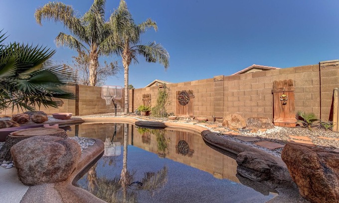 San Tan Valley House | Backyard oasis with private solar heated pool, hot tub and tons of amenities!