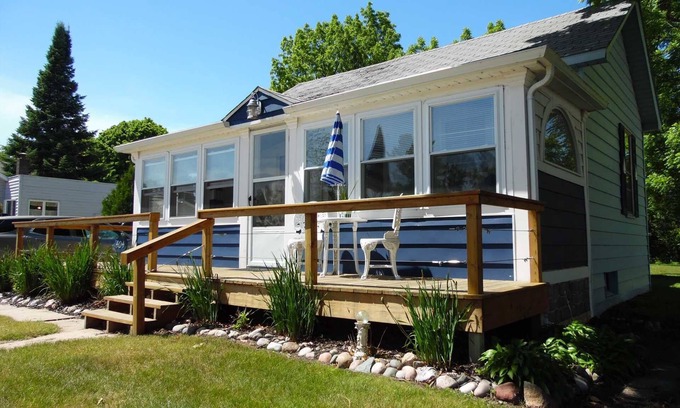 Tawas City House | Bay House Location is perfect for a stroll down Newman Street across from Public Lake Huron Beach!
