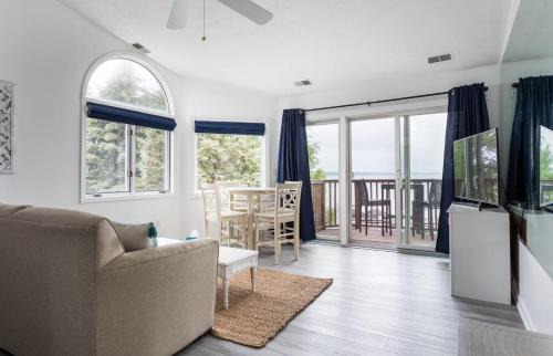 Traverse City House | Beach 321 with Vaulted Ceilings Pool Hot Tub and Stunning Views from Private Deck