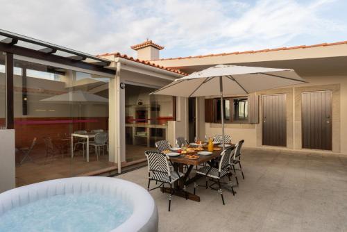 Vila Cha House | Beach Villa with Jacuzzi & Garage by HostWise