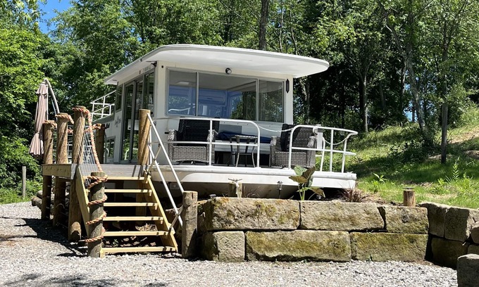 Langsville Boat Rental | Beached houseboat with lots of character and deck jacuzzi