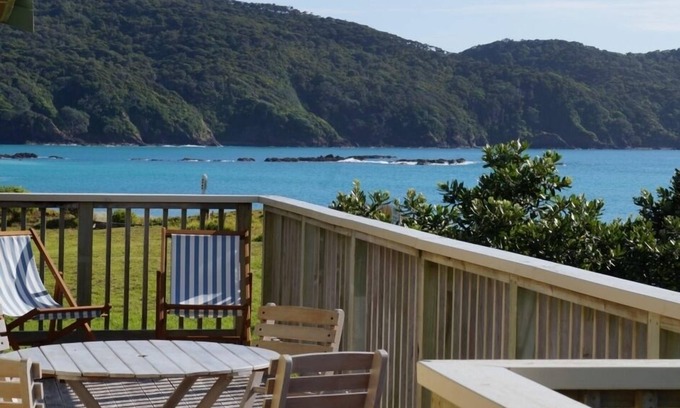 Whangaruru House | Beachfront Bland Bay tranquility with stunning sea views from sun-drenched deck