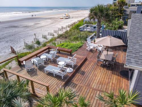 Sea Dunes Apartment | Beachfront Deck with steps down to the white sandy beach Sea Dunes Sandcastle 1A