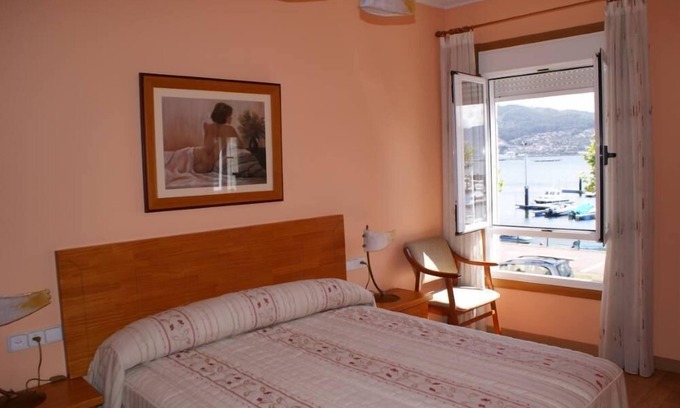 Moana House | Beachfront villa with private garden and patio and free parking on the street.