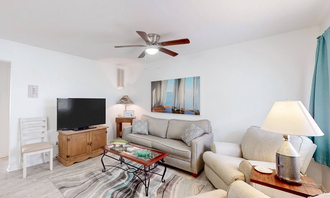 Caine Woods Condo | Beachside dog-friendly condo with furnished deck & walkable location