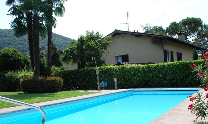 Caslano Apartment | Beautiful apartment for 4 guests with pool, WIFI, TV, balcony, panoramic view and parking
