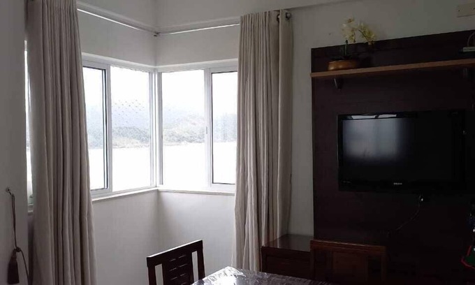 Aparecida Apartment | Beautiful apartment, overlooking the sea at Ponta da Praia with Internet Access