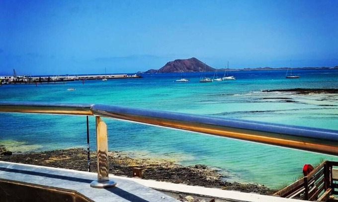 Corralejo Apartment | Beautiful Beachfront APTMTO at waters edge with stunning Ocean and Harbour views