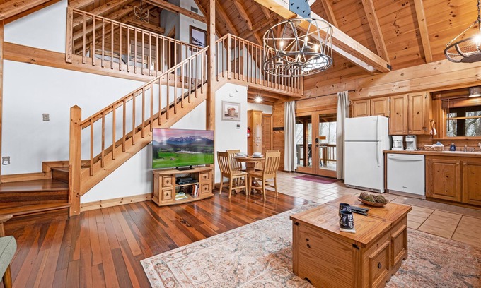 Gatlinburg - Pigeon Forge Cabin | Beautiful cabin nestled among the trees, featuring a loft and relaxing hot tub.