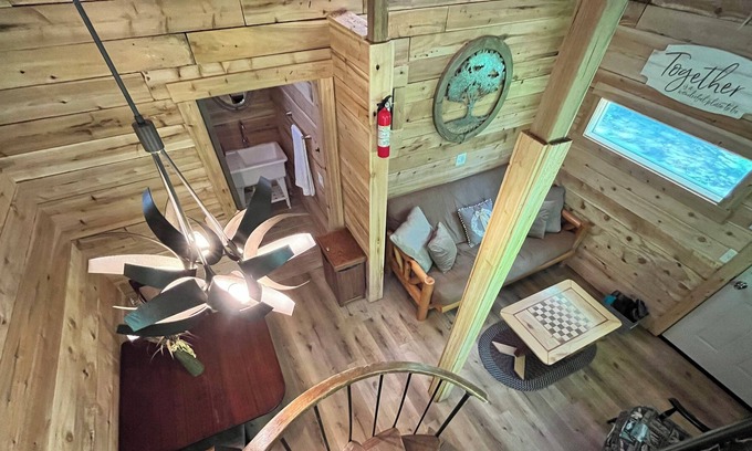 Kent County Cabin | Beautiful cedar treehouse that has wall-to-wall windows, forest and river view!