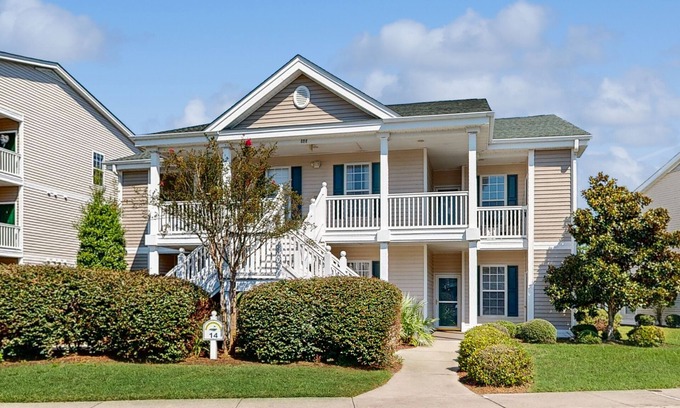 Sunset Beach Condo | Beautiful dog-friendly coastal home close to beach, AC, and shared pool.