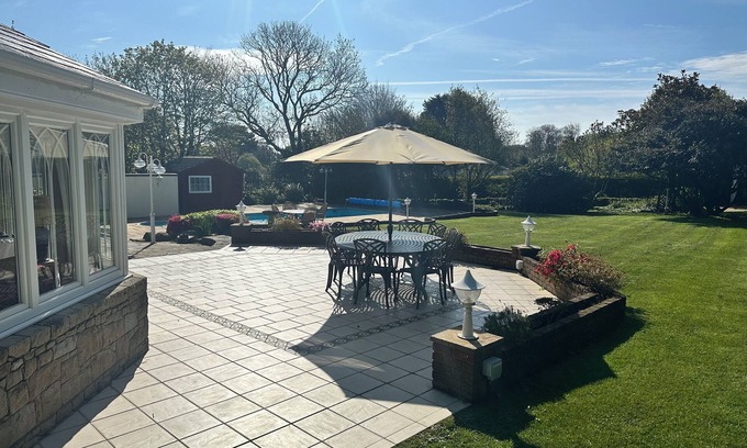 Village de Putron House | Beautiful five bedroomed family home in Guernsey with heated pool