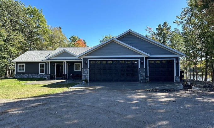 Grand Rapids House | BEAUTIFUL lake front home with a private beach, dock and large yard