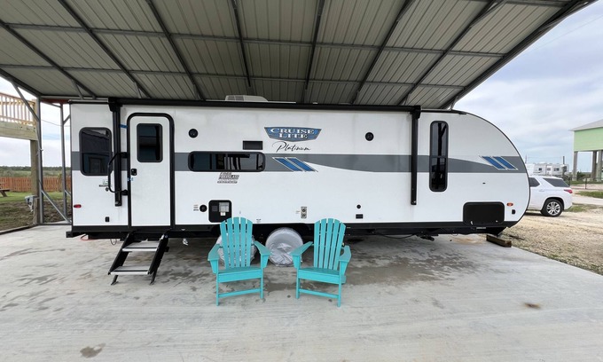 Port Bolivar House | Beautiful NEW 2023 camper covered on concrete slab. Sit and enjoy the barges