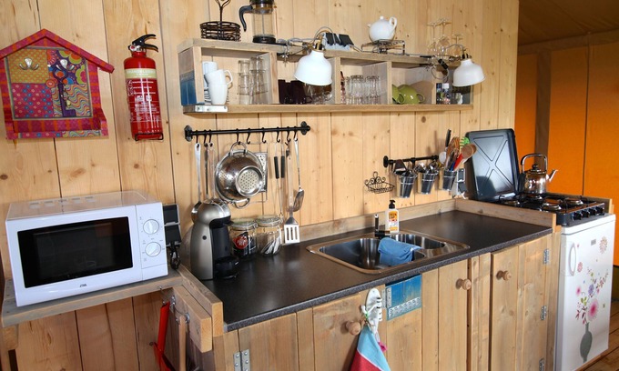 Enumatil Cabin | Beautiful furnished safari tent and circus wagon with private bathroom.