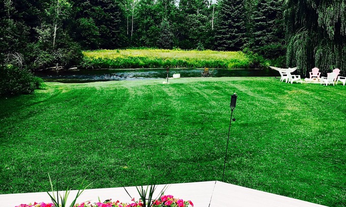Mayfield House | Beautiful private home on the Boardman River with large yard, deck and hot tub.