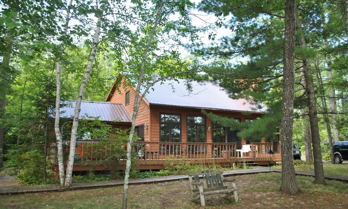 Hayward House | Beautiful round lake northern cedar modern vacation home