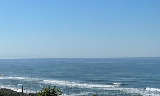 Warner Beach Cottage | Beautiful sea view from wooden balcony with sunrises to die for !