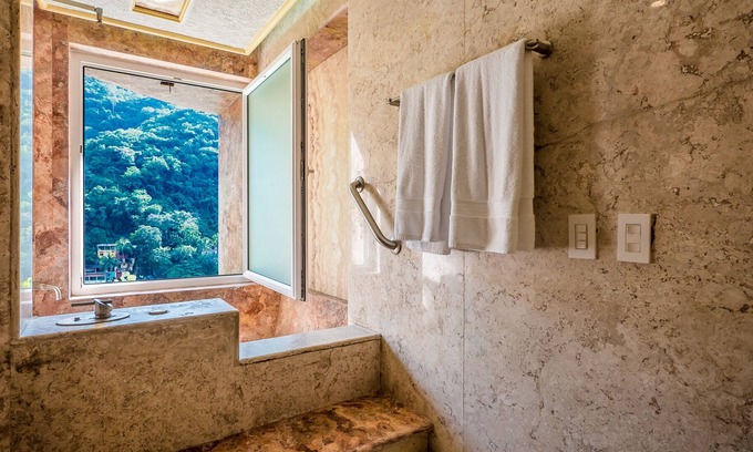 Boca de Tomatlan Apartment | Beautiful suite with two king size beds, with a large terrace with beach view