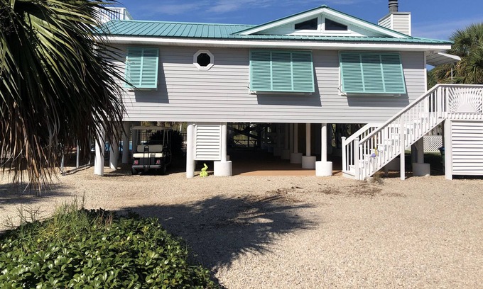 Panacea House | Beautiful vacation house on a canal with outdoor pool & short distance to beach!