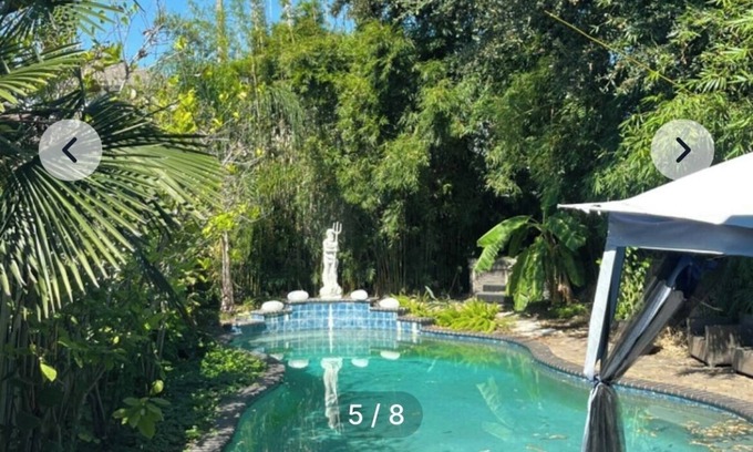 Treme House | bedroom and en suite bath in historic New Orleans home with pool & WiFi