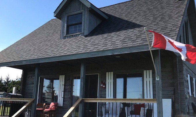 Morell Cottage | Best of all worlds - bright log cabin just a short walk to beautiful PEI beach