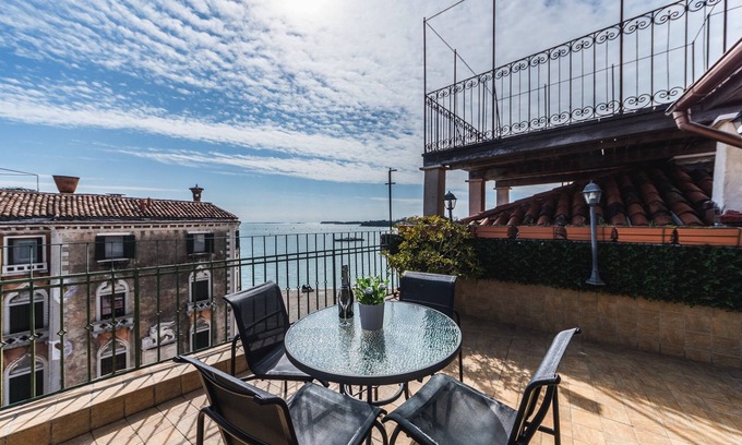 Castello Apartment | BIANCIAL PENTHOUSE WITH SPLENDID TERRACE SOLARIUM OVERVIEW OF THE LAGOON