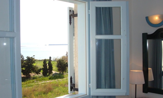 Drios Apartment | Blue and Sea room with window side sea view