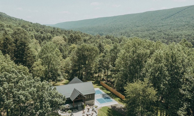 Kunkletown Cabin | Blue Creek Chalet with luxurious beds, pickleball, hot tub, fireplace, pool table & more