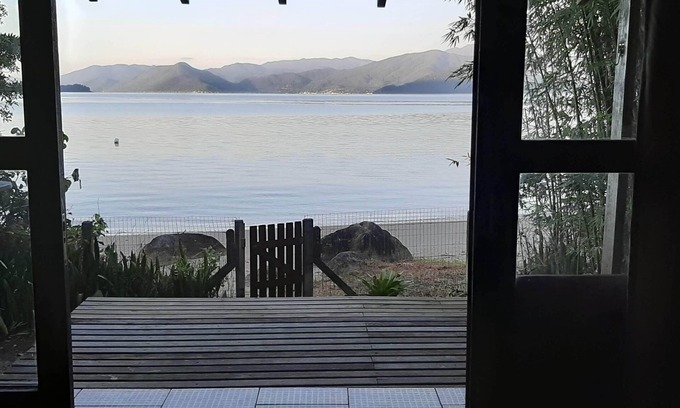 Florianopolis House | Delightful house on land with 5 beaches! Feet in the sand and peace!