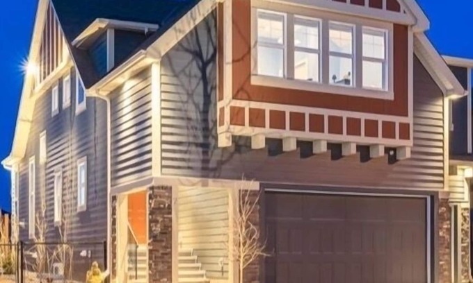 Okotoks House | Bright, spacious family home with great a outdoor space overlooking green space.