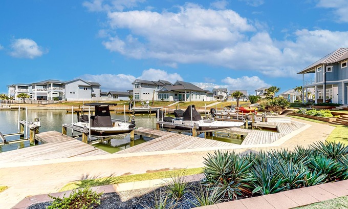 Rockport Villa | Bright waterfront villa with pool, boat slip, patio & balcony in gated community