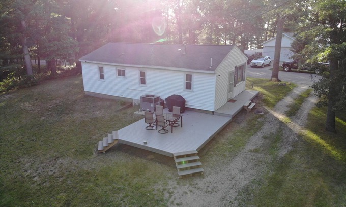 Newaygo House | Brookside Retreat- Charming home with lakes and rivers nearby