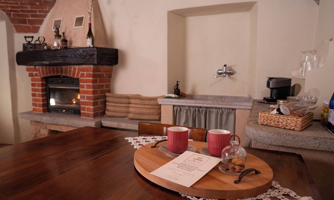 Lessona Bed & Breakfast | Bruno Selvago's Casba. Rustic house with exposed brick surrounded by vineyards.